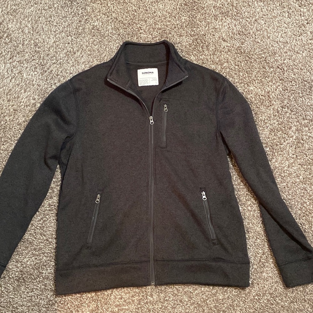 Charcoal Gray zip up jacket.